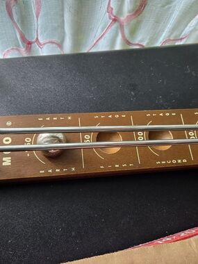 classic wooden "Shoot the Moon" board game, featuring a metal ball and rail